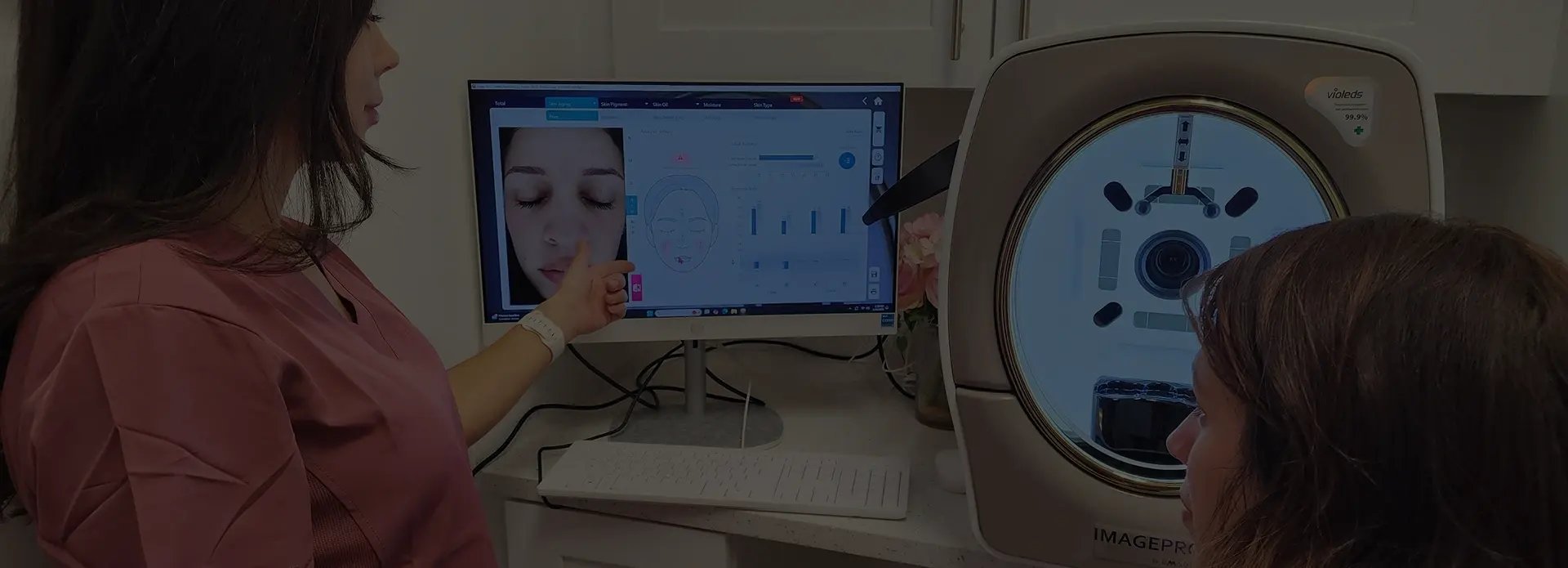 A Golden Rose clinician reviewing a patient's skin analysis scan on screen